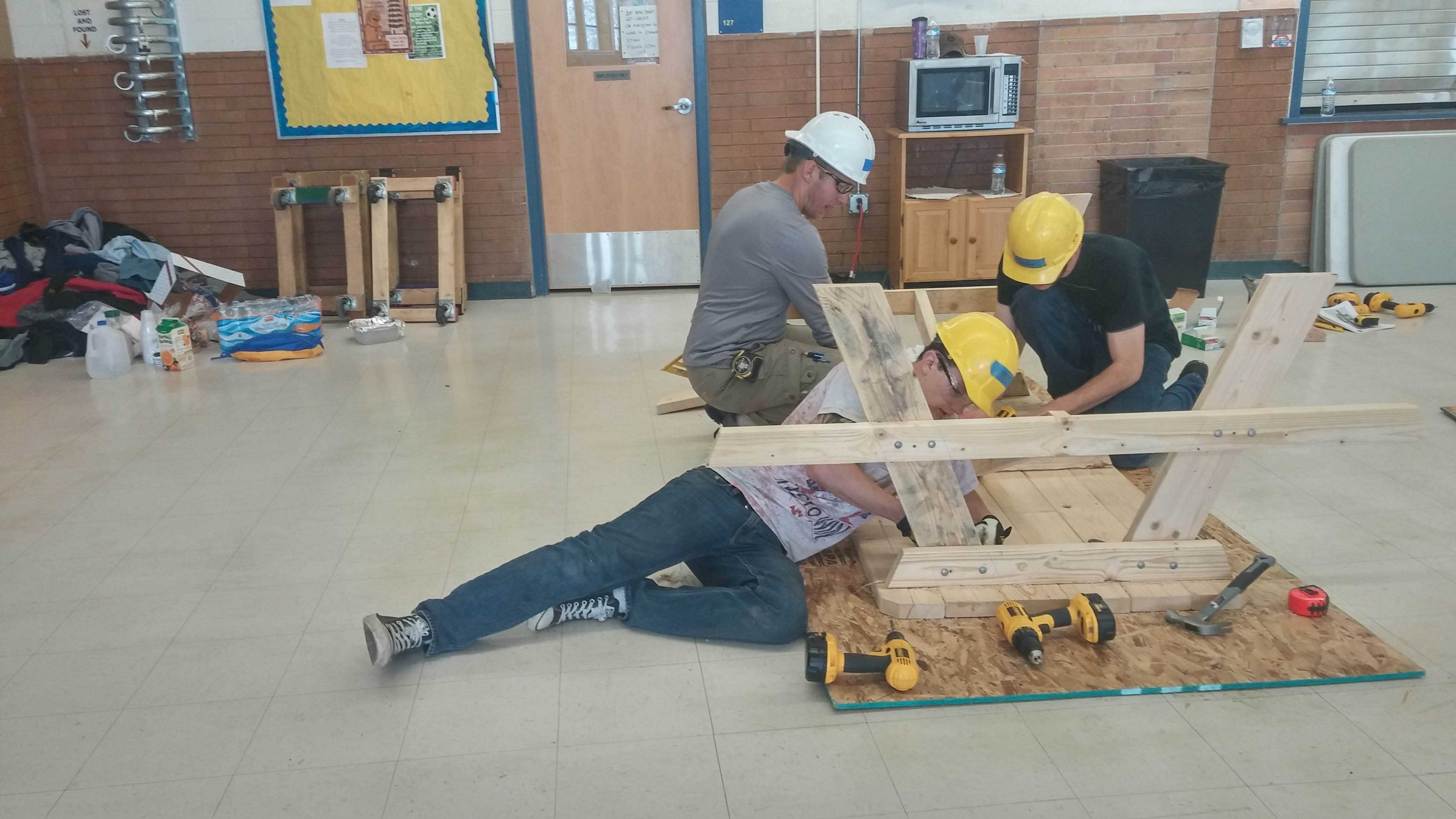 Students working on picnic tables last spring for Wheat Ridge's construction class. By Rachel Vigil File Photo