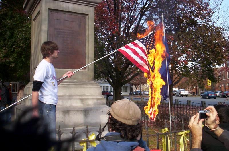 A+man+exercising+his+First+Amendment+rights+by+burning+the+flag.+Courtesy+of+thefreepatriot.com