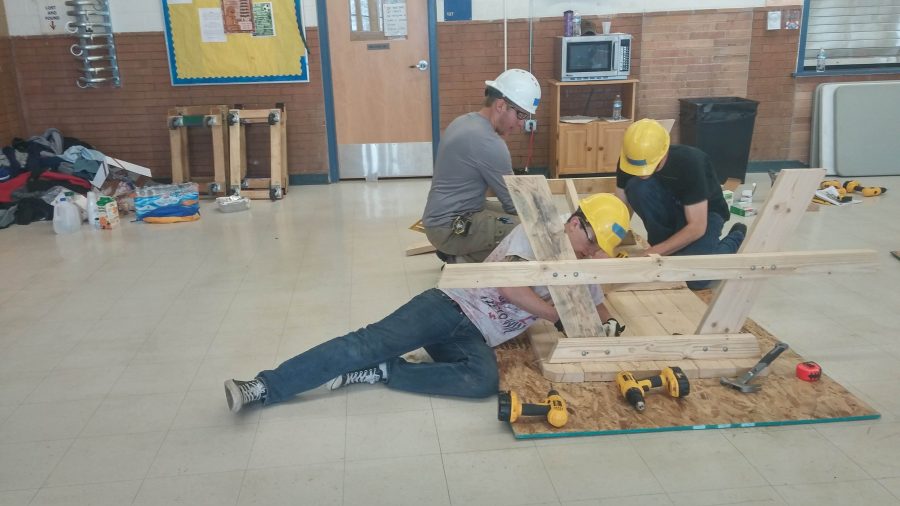 Students working on picnic tables last spring for Wheat Ridges construction class. By Rachel Vigil File Photo