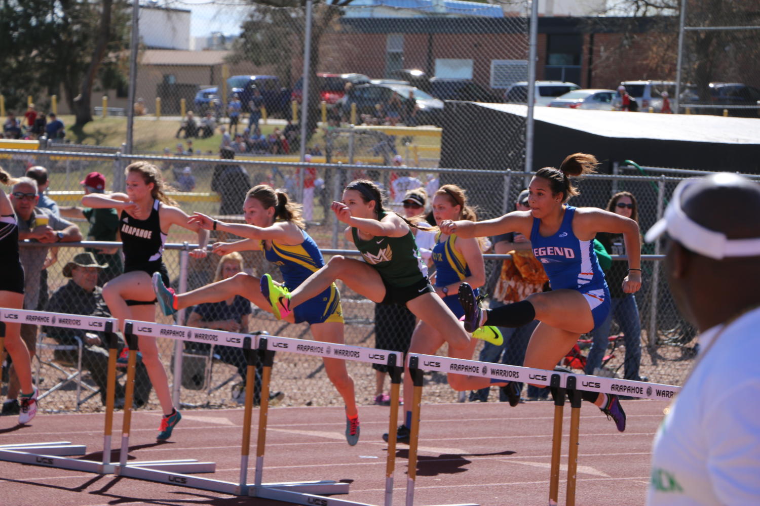 Lindsey Roberts running the 300 meter hurdles at a track meet. courtesy of Scott Chamberlin