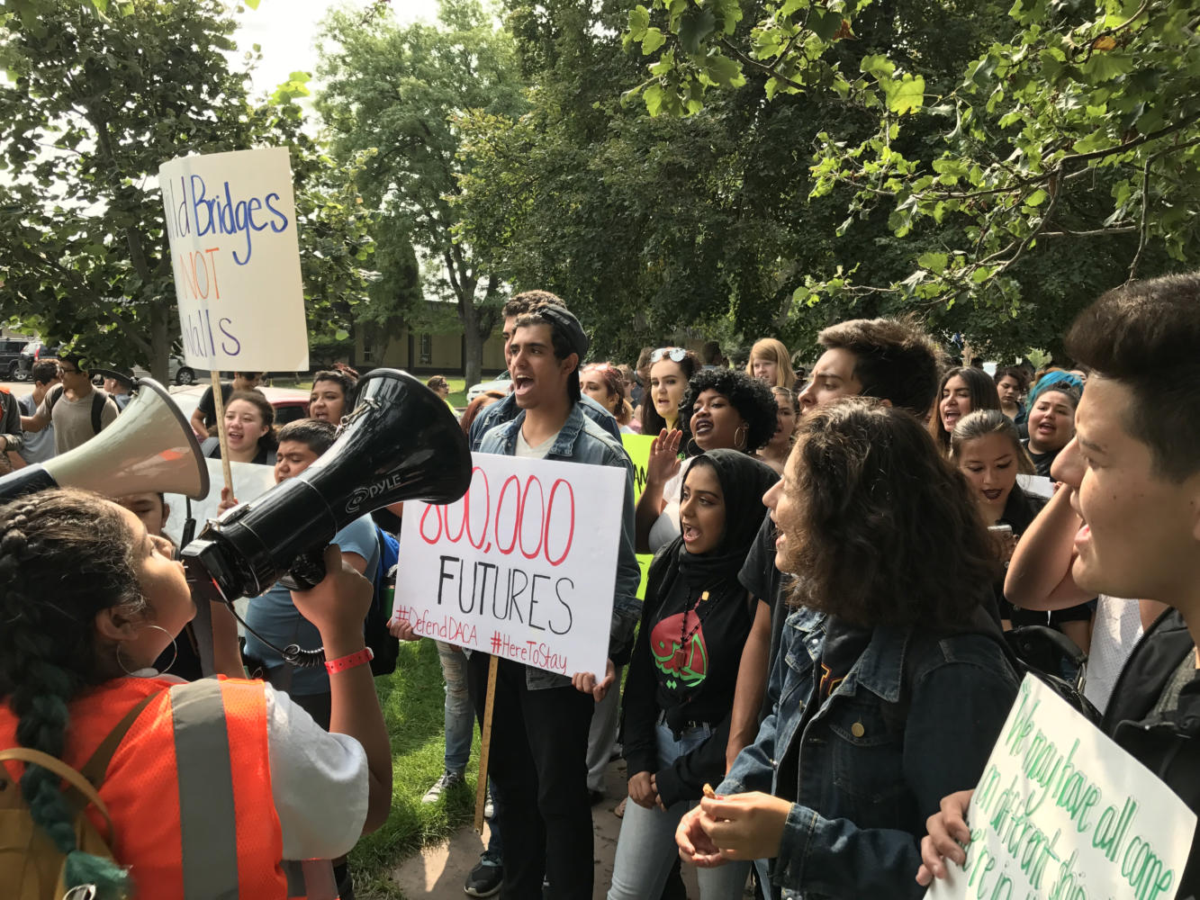 Students leading a chant in Denver at a walkout in protest of Trump’s repeal of
DACA. Courtesy of Melanie Asmar