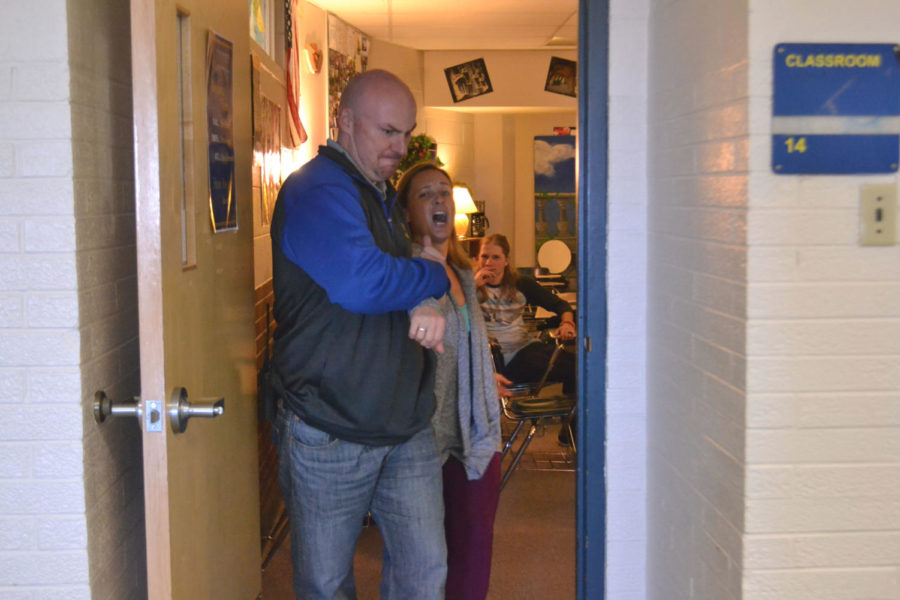 Murphy being dragged out of her classroom by Patrick Rock.