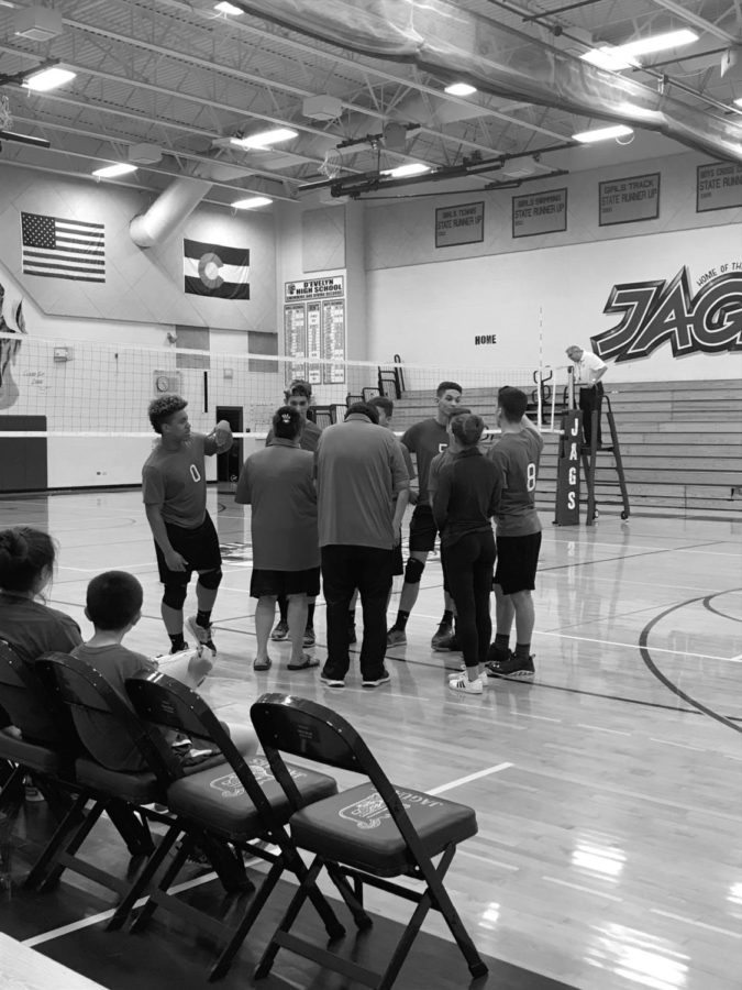 The volleyball team discusses  the game on April 26. 