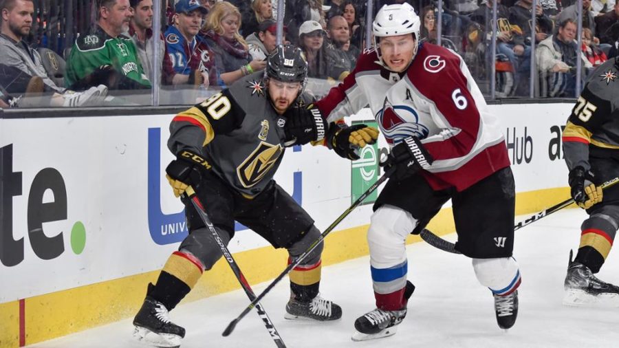 Avalanche+defenseman+Erik+Johnson+battles+Vegas+Golden+Knights+forward+Tomas+Tatar+for+puck+possession