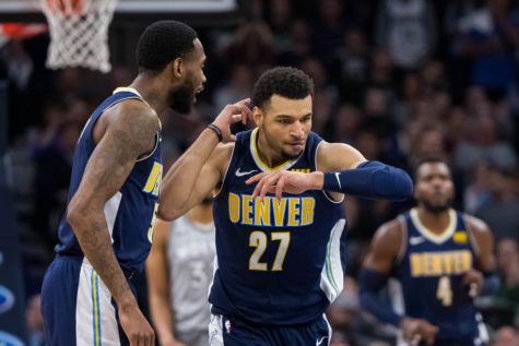 Jamal Murray in the zone, as Will Barton looks on.