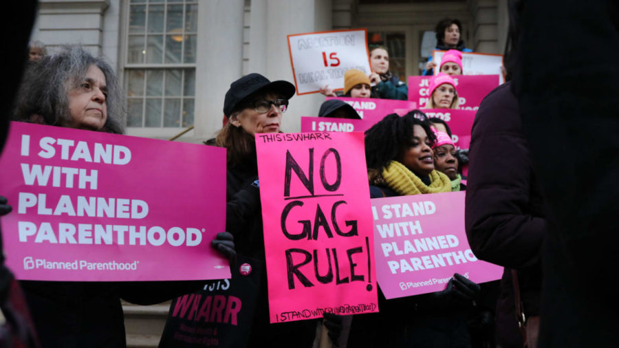 People protest on recent news of Planned Parent hood and Title X.