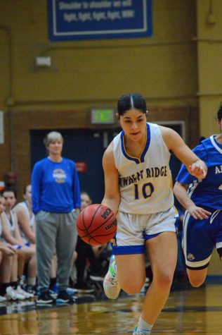 Sydney McCullum runs across the court 