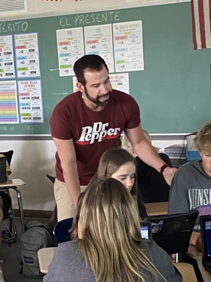 Mr. Sepich helps students in his class.